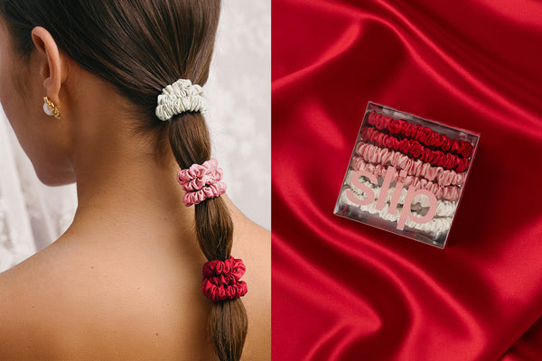 Woman with braided hair using slip scrunchies and a box of scrunchies on red fabric.