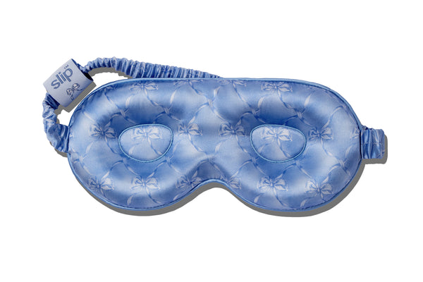 Blue contour sleep mask with bow pattern on a white background
