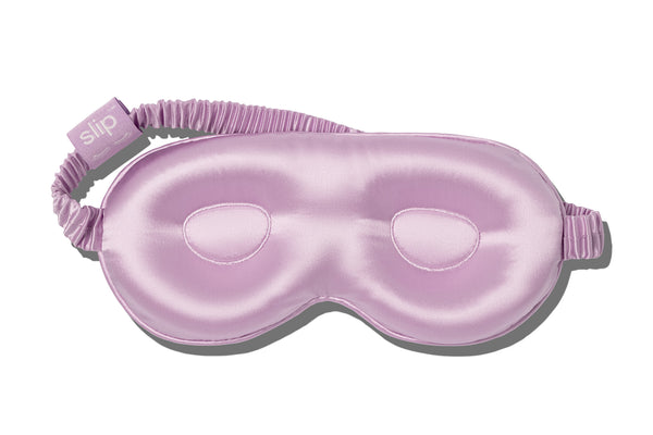 A purple slip silk contour sleep mask designed to protect delicate eyelash extensions, on white background.