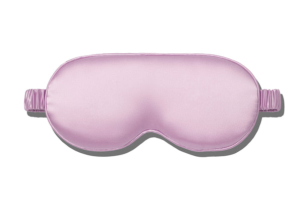 A purple slip silk contour sleep mask designed to protect delicate eyelash extensions, on white background.