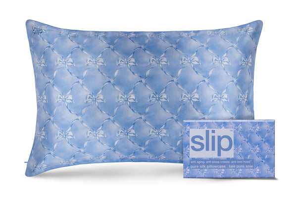 Blue pattern pillowcase with packaging labeled 'slip' on a white background