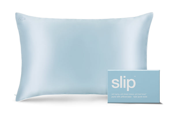 A seabreeze blue slip queen pillowcase with an invisible zipper closure. Displayed alongside slip branded packaging on a white background.