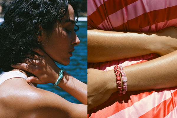 Model with slip skinny scrunchies on her wrist and hair.