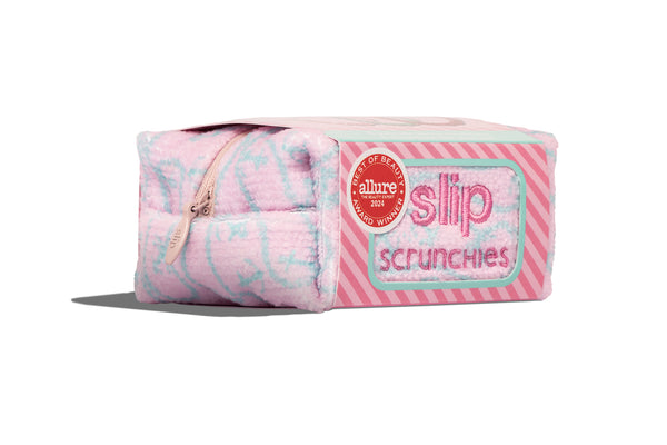 Slip scrunchie complimentary pouch in pink and blue on a white background.