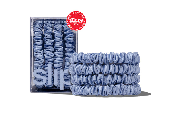 Blue silk scrunchies with packaging and 'Allure' beauty award on a white background