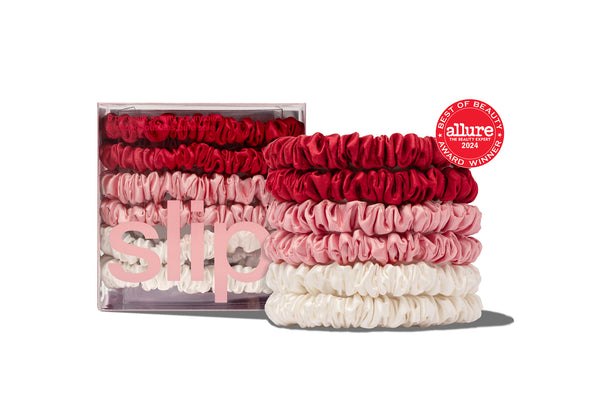 Set of red, pink, and white hair ties with 'slip' packaging on a white background.