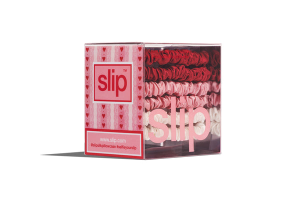 Box of slip skinny scrunchies with pink and red design on a white background