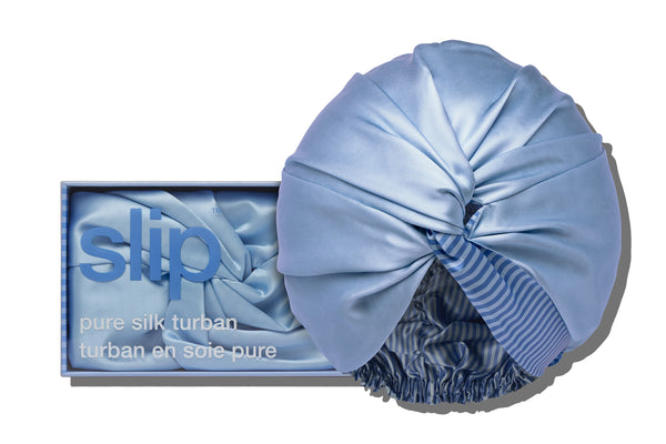Blue silk turban with packaging displaying 'slip' brand on a white background