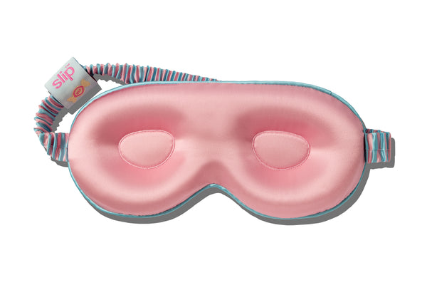 Pink sleep mask with striped band on a white background