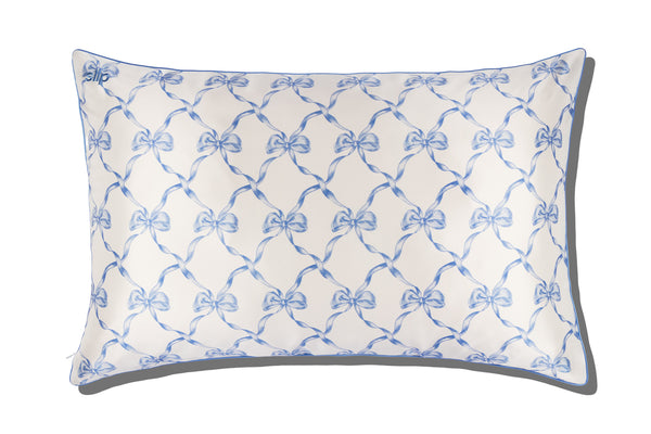 Pillowcase with blue bow pattern on a white background