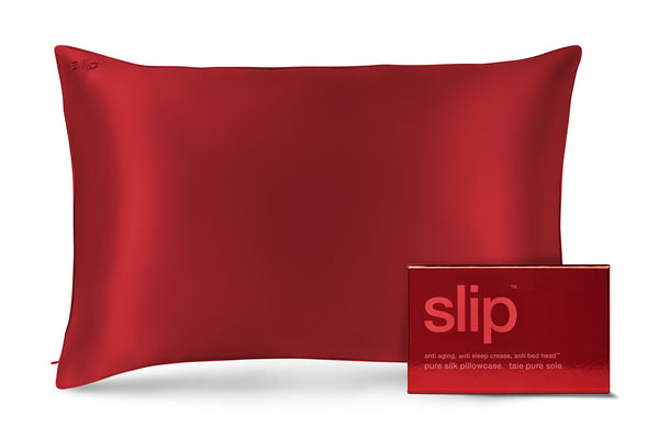 Red silk pillowcase with 'slip' packaging on a white background