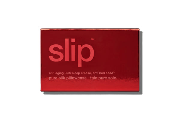 Red packaging of 'slip' pure silk pillowcase on a white background