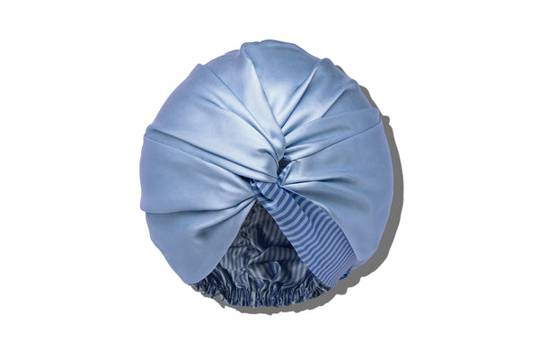 Light blue silk turban on a white background
