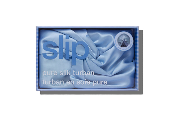 Blue silk turban in a 'slip' branded box on a white background