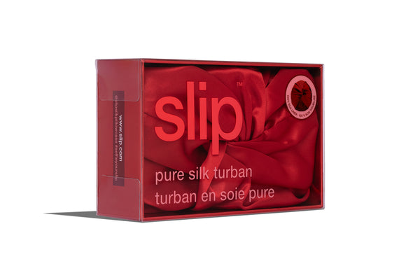 Box of red slip pure silk turban on a white background