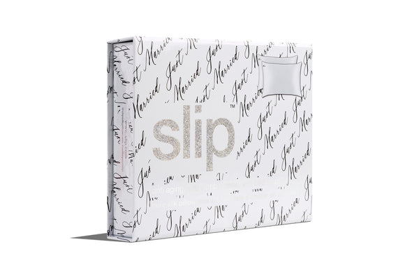 Slip packaging with glitter logo and 'just married' repeated text on a white background. 